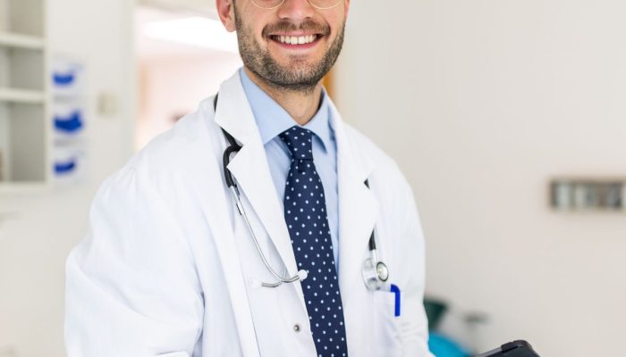 portrait-of-a-happy-young-doctor-in-his-clinic-royalty-free-image-1661432441